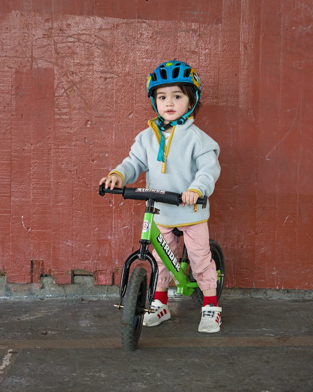 Norris reluctantly poses for a photo while telling me he wants to race down a hill.